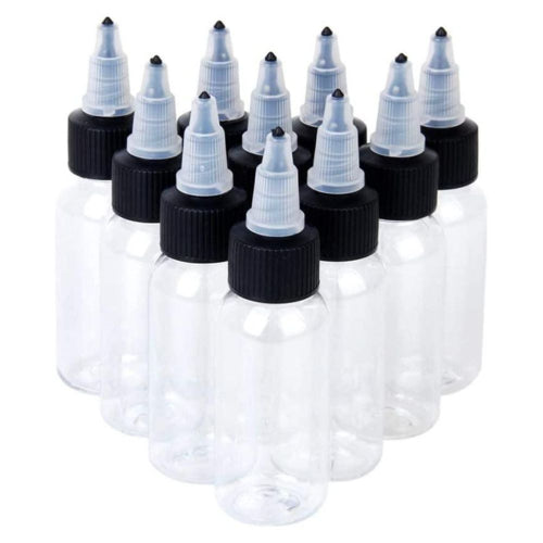 Set of clear bottles with black caps on a white background